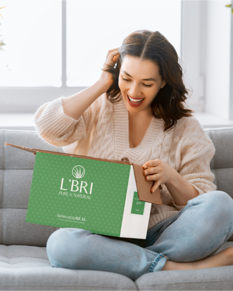 A woman opening a L'BRI box